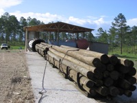 Pressure treatment tube and lumber being treated